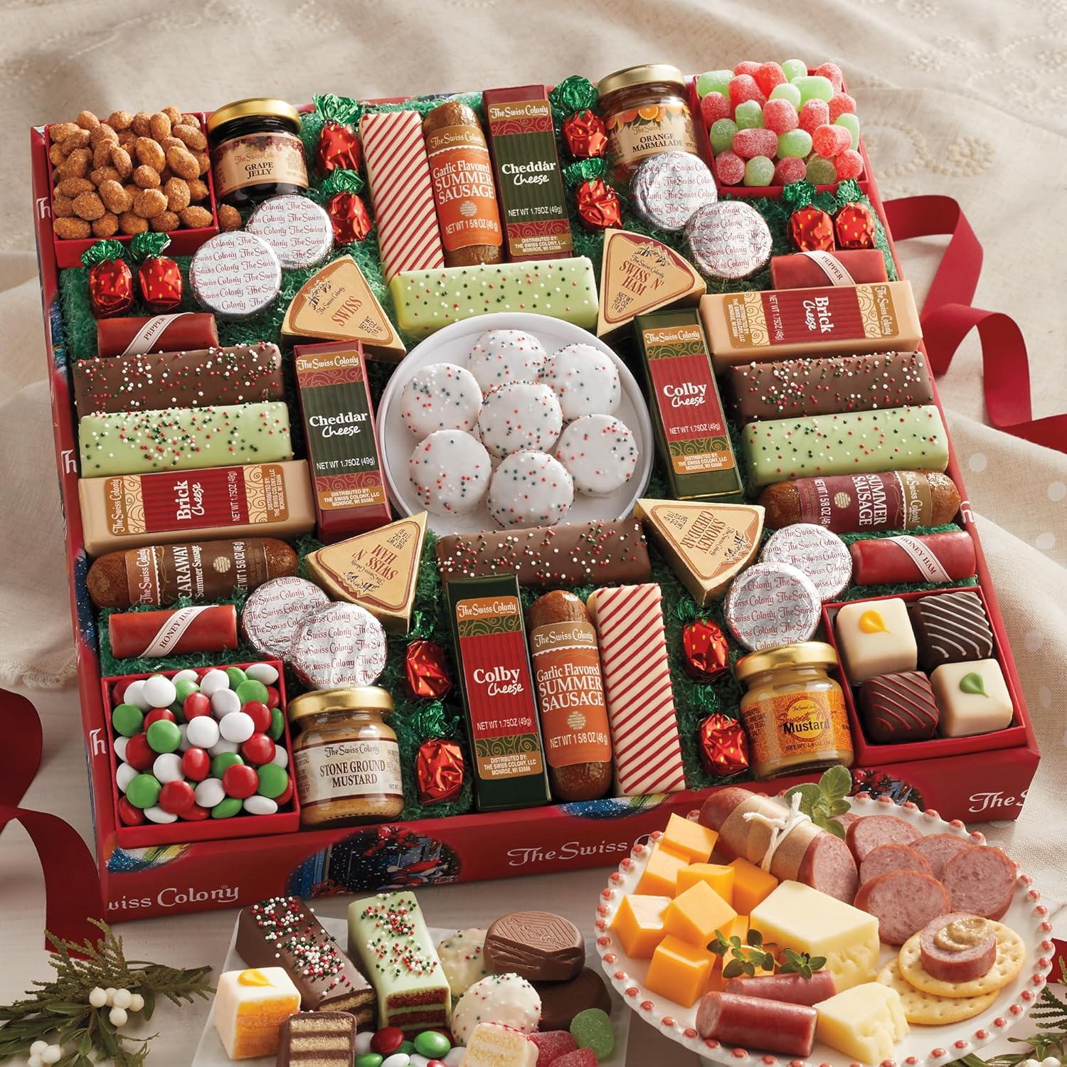 The Swiss Colony 43 Season Pleasers - Assorted Summer Sausage Meats, Cheese Bricks & Wedges, Spreadables, Candies & Chocolate Treats with Merry Christmas Petits Fours Gourmet Mini Layer Cakes